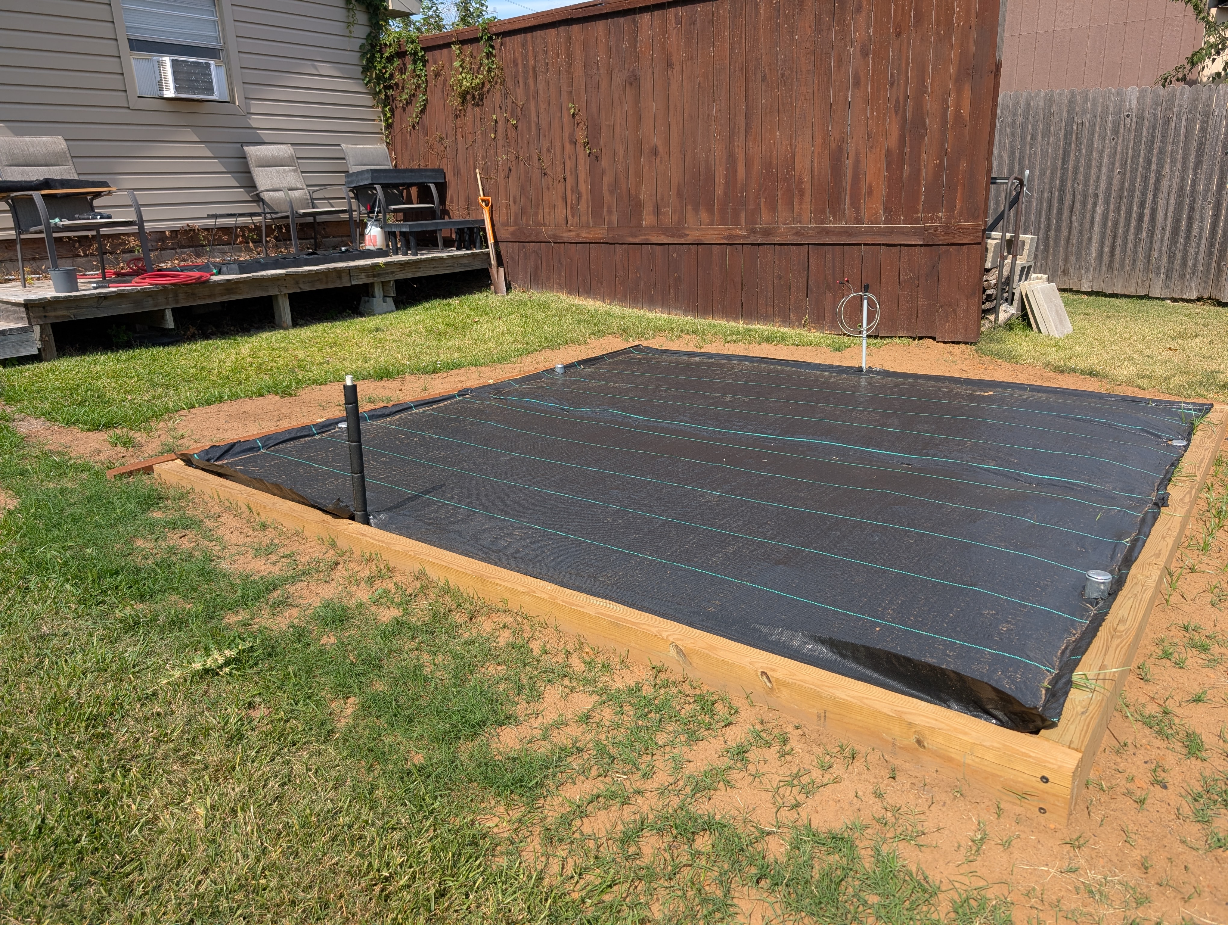 Etexgreenhouse | A dirt slab inside retainer